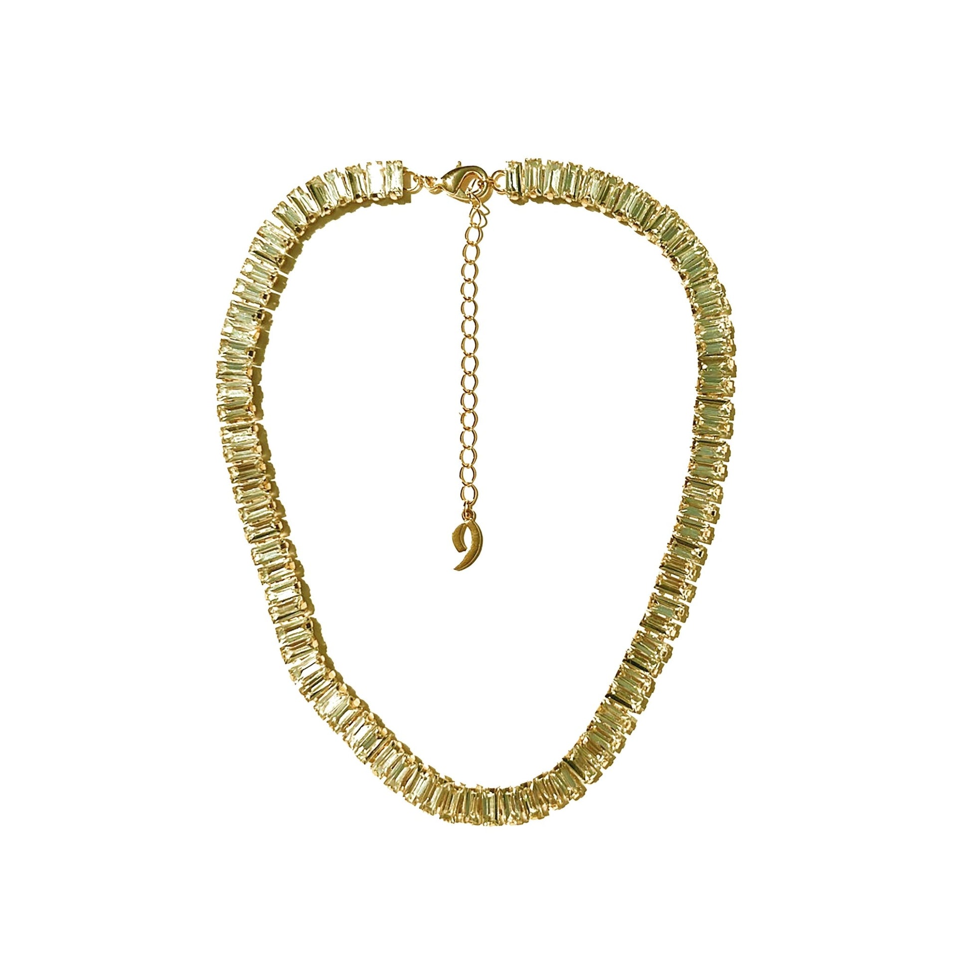 a necklace with a gold chain and a crescent