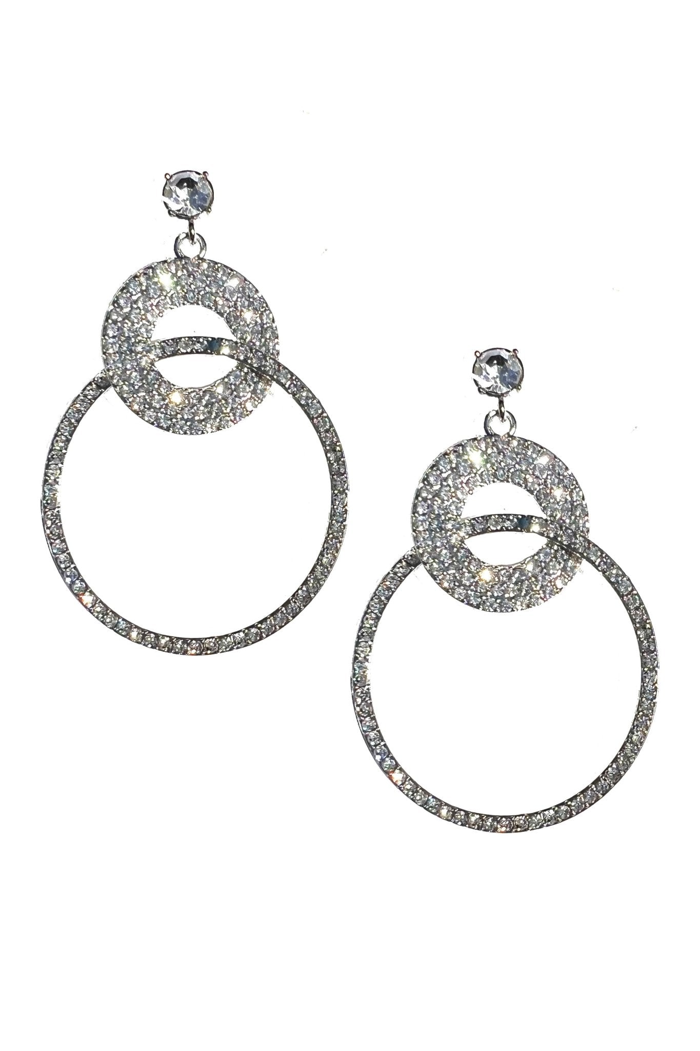 a pair of earrings with a circular design