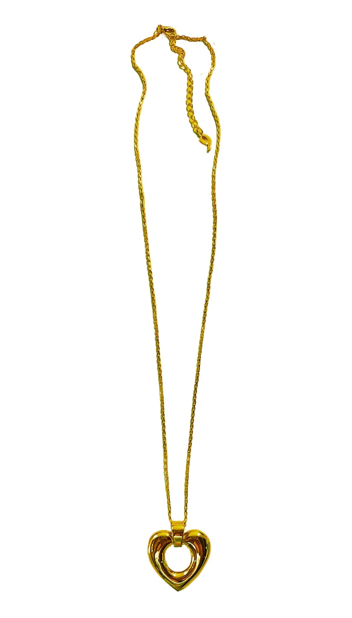 Long necklace with open center heart pendant on a wide bale. Gold plated .