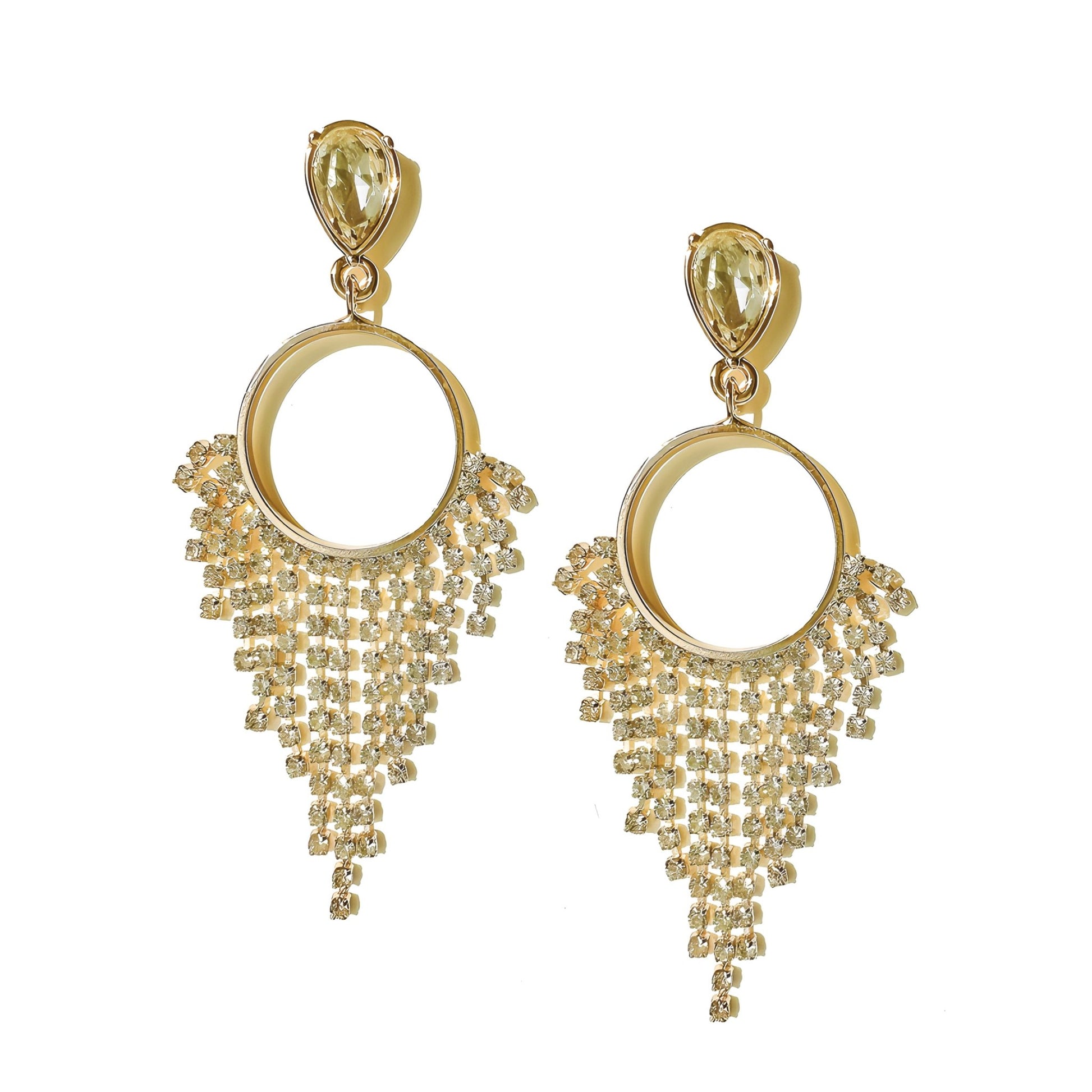 a pair of gold toned earrings with a circular design